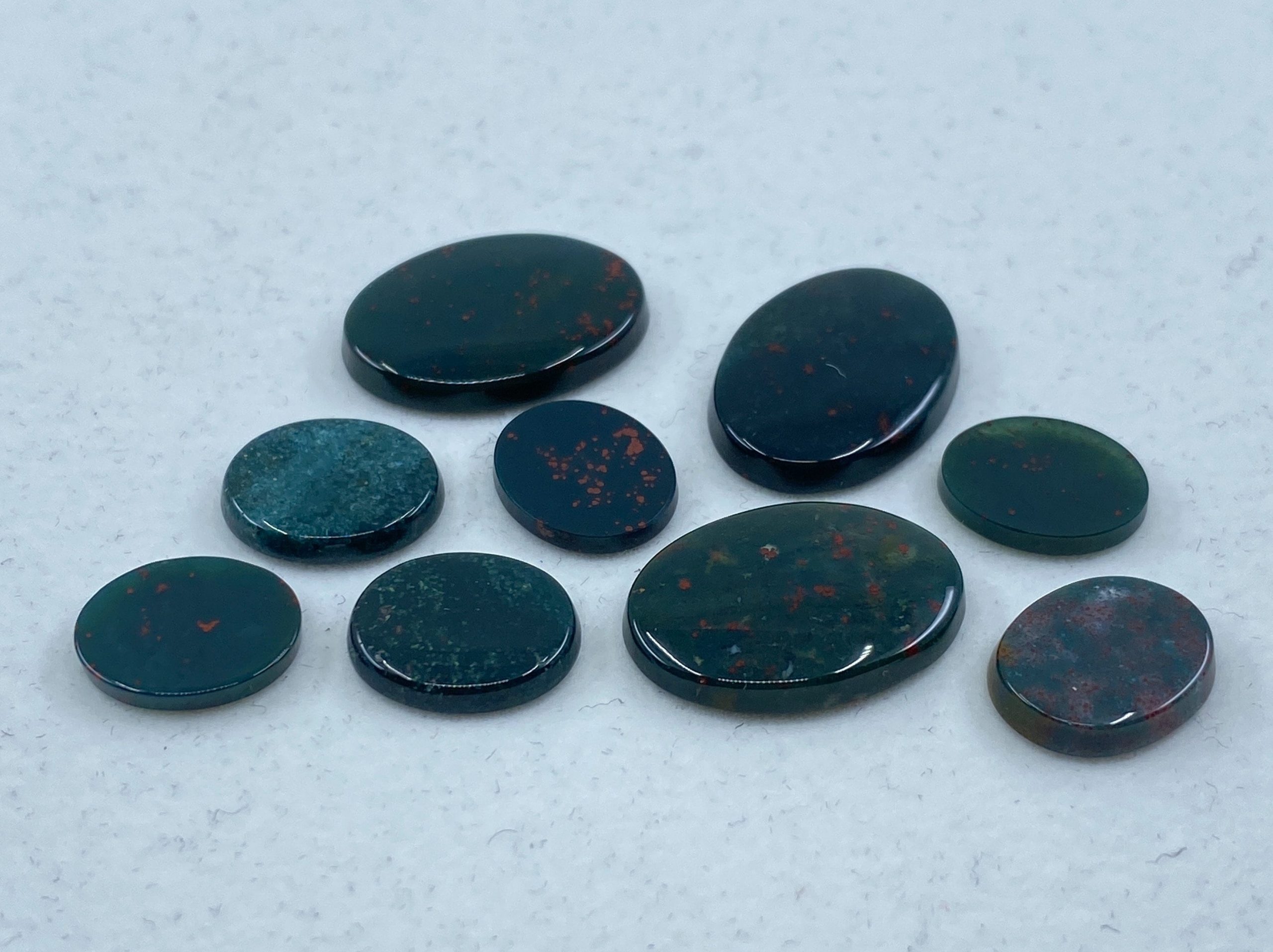 il fullxfull.3161585962 eem1 scaled Bloodstone Single Bevel Buff Top (SBBT) Oval Loose Gemstones In Assorted Sizes Ranging From 7x5mm To 25x18mm