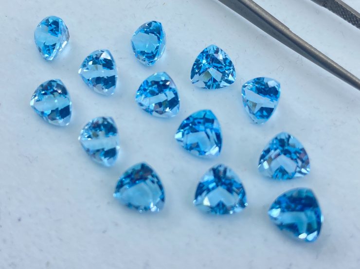 il fullxfull.3186222341 qtai scaled Sky Blue Topaz Faceted Trillion Shape Loose Gemstones In 6mm, 7mm & 10mm For Jewellery Making