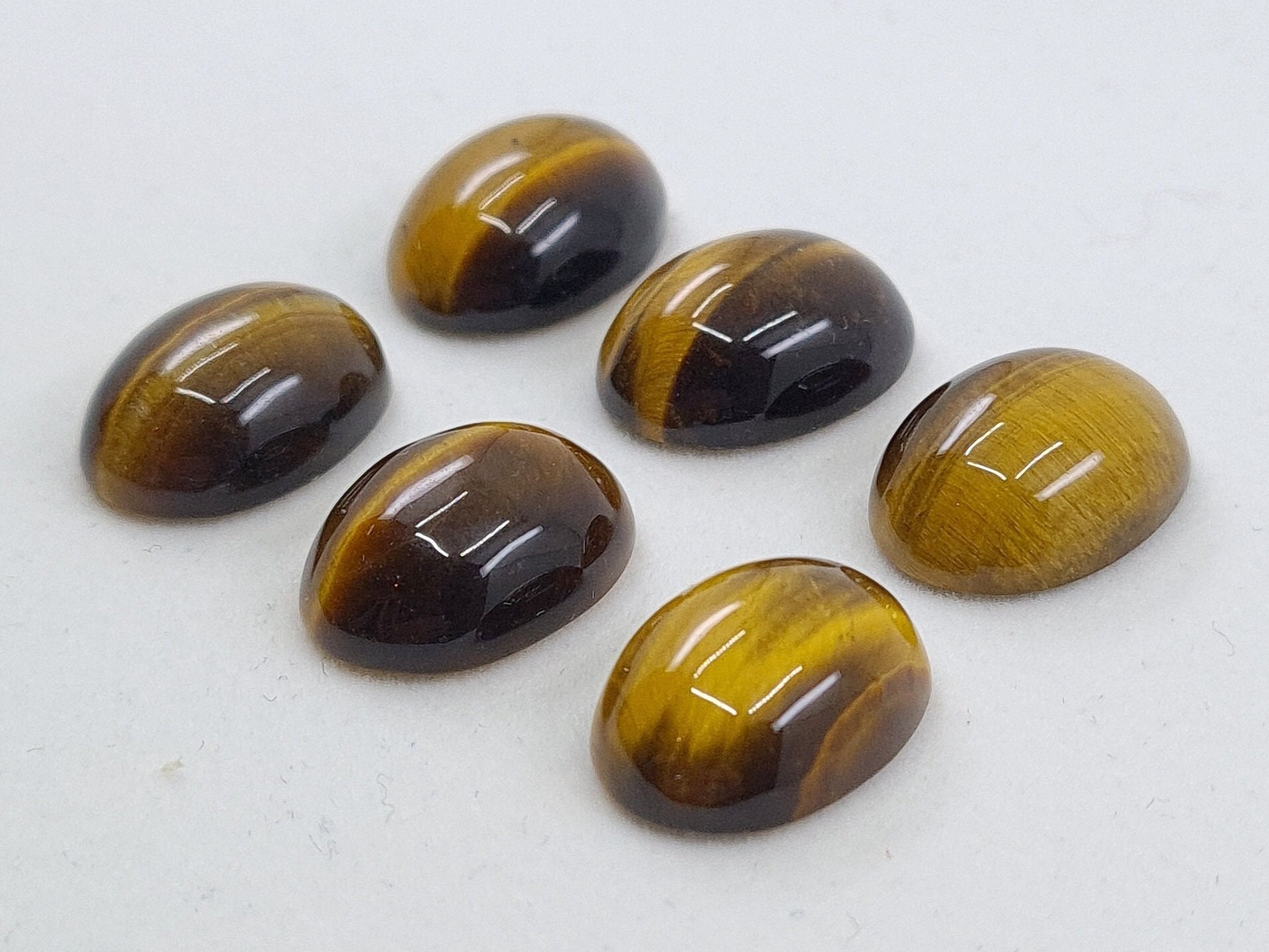 Golden Tiger Eye Cabochon Oval Loose Gemstones In Assorted Sizes Ranging From 8x6mm to 25x18mm For Jewellery Making