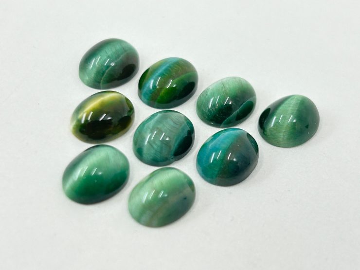 il fullxfull.5978619888 8y52 scaled 100 Pieces of Green Cats Eye Oval Shape Cabochon Loose Gemstones in 9x7mm for Jewellery Making